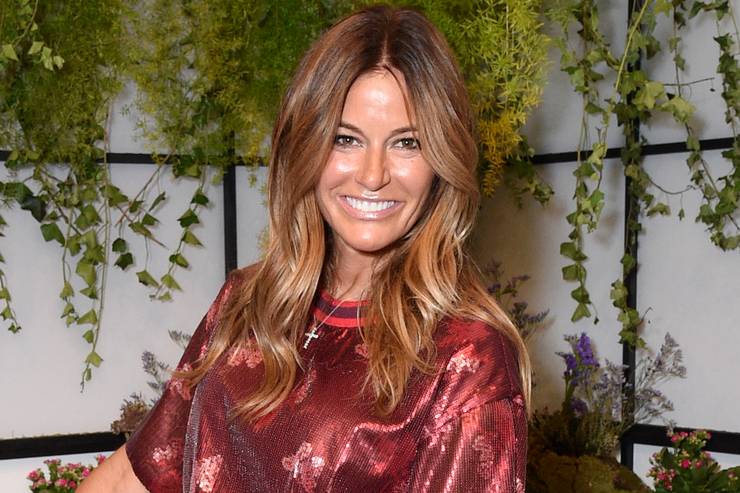 Kelly Bensimon wearing sparkly red shirt smiling